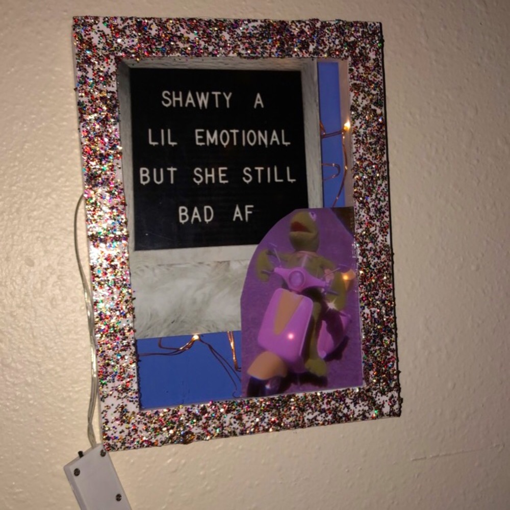 shadow box with pictures and fairy lights